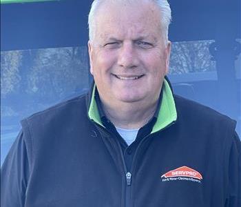 Bill Wise, our Business Development Executive, standing in front of one of our SERVPRO vehicles.