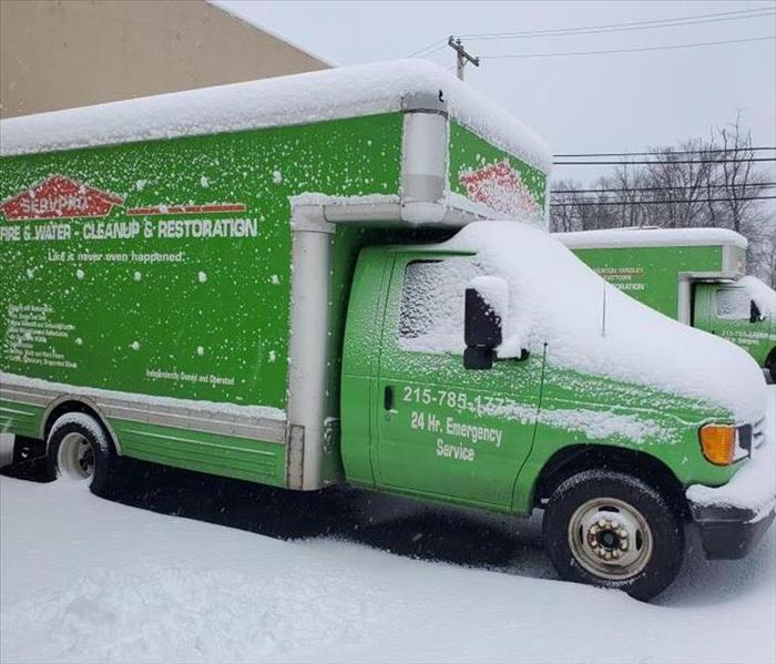 Green truck and snow